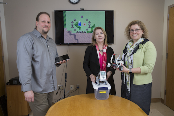 Dr. Eric Mandell (left) and Jadwiga Carlson (right) with grant administrator Dr. Moira van Staaden