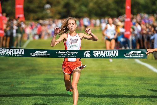 Women’s Cross Country runner sprints through the finishing line