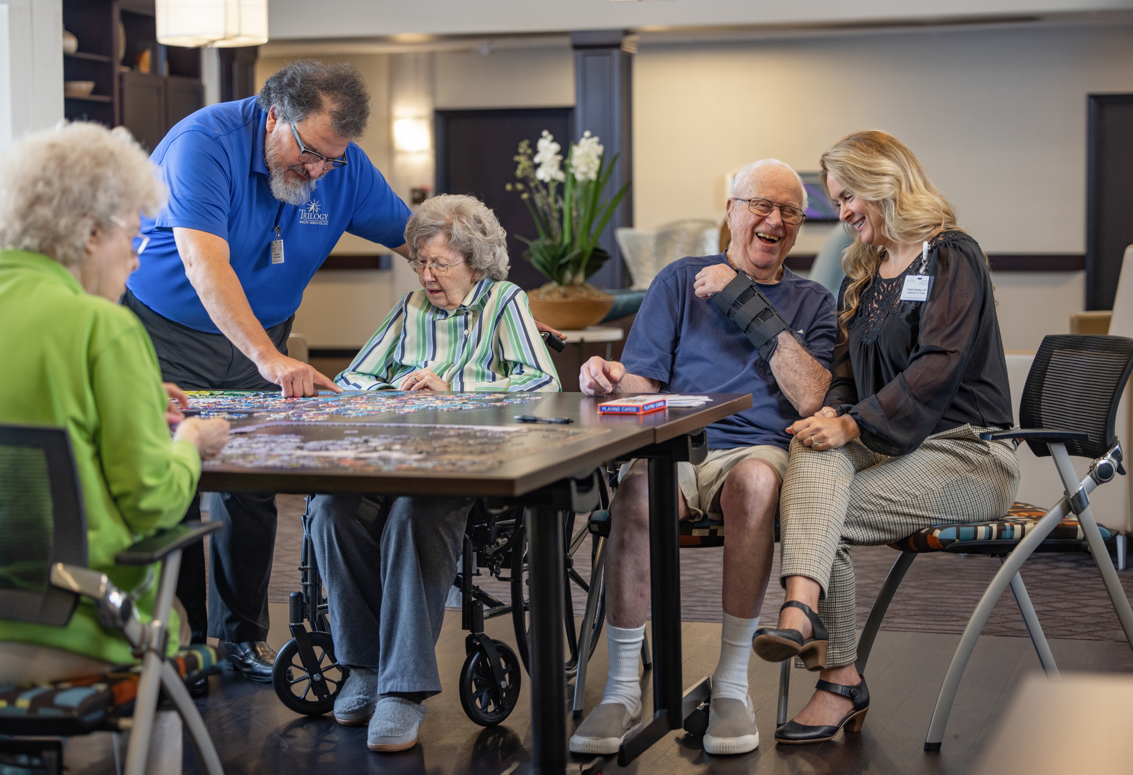 People at table playing cards