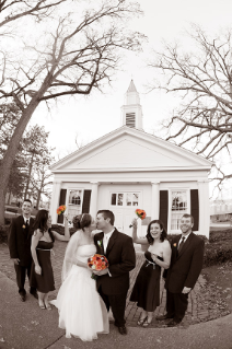 Mary Kay (Coulter) Inkrott '05, '06 and Andy Inkrott '06 share a kiss in front of Prout Chapel on their wedding day, November 14, 2009. The couple met at a football game at the Doyt in 2004