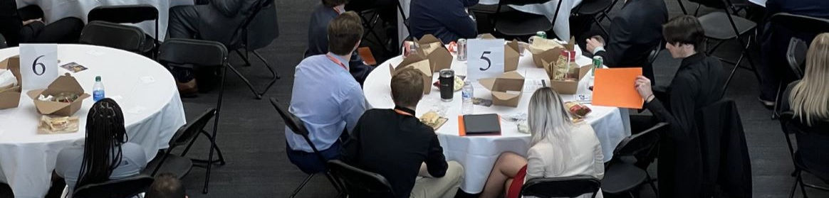 People seated at tables for the 2022 LEAPS conference