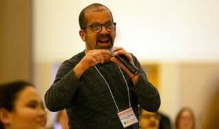 Dr. Francisco Cabanillas asking a question at the keynote performance of Ariana Brown