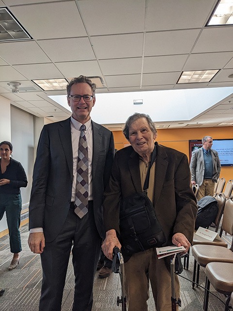 Francis Gavin and Gary Hess are standing and smiling for a picture