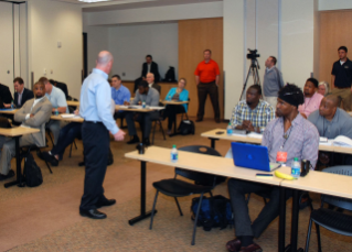 NFL Referee John Parry holds a press conference for boot camp participants.