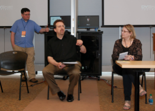 Howard Deneroff (center) announces the awards for best radio commentary. Stephen Merrill (left), an instructor in the BGSU Department of Telecommunications, recorded and produced the commentaries, and Lori Liggett (right), an instructor in the BGSU Department of Telecommunications, helped judge the commentaries.