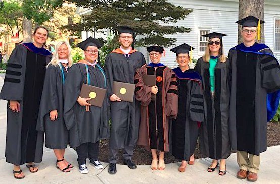 faculty and graduates pose on BGSU campus