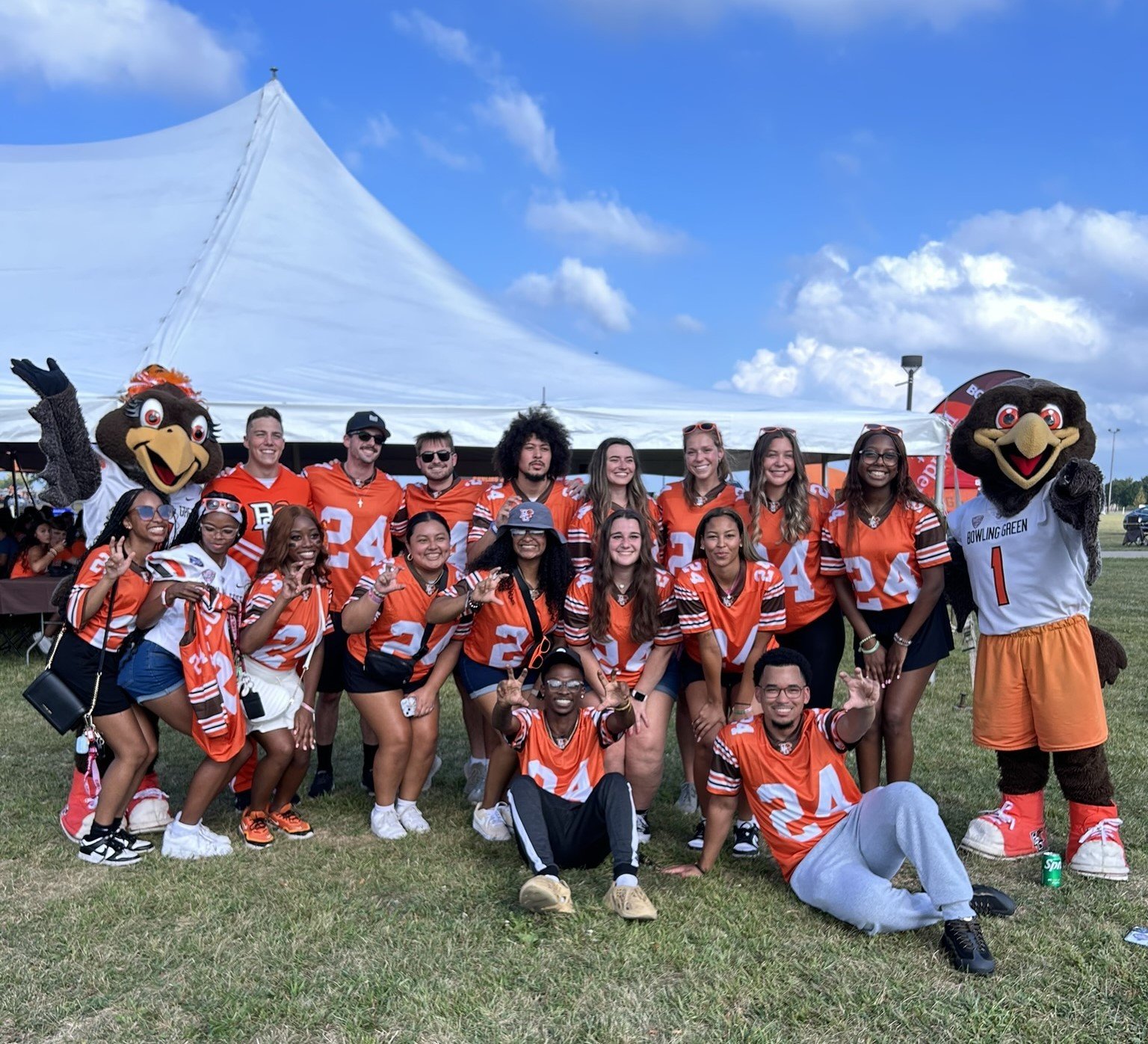 students grouped at a football game