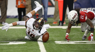 Falcon linebacker Austin Valdez battles for the football during the Mid-American Conference Championship Game.