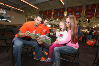 Falcon student athletes read to visitors at the BGSU 2015 Literacy in the Park.