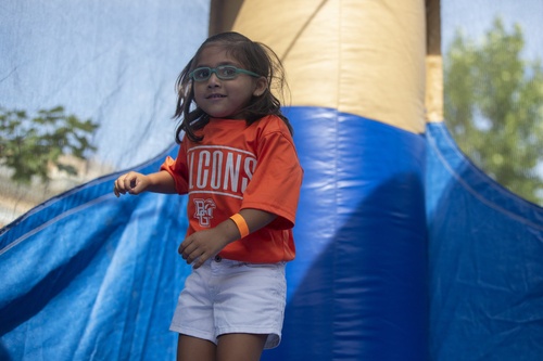 A girl plays in a bounce house