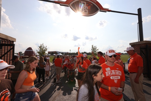 People enter a football stadium