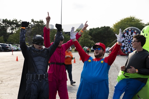 Students in costumes cheer