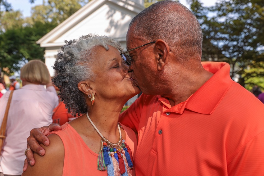 A pair of Falcon Flames smooch after saying "I do" again.