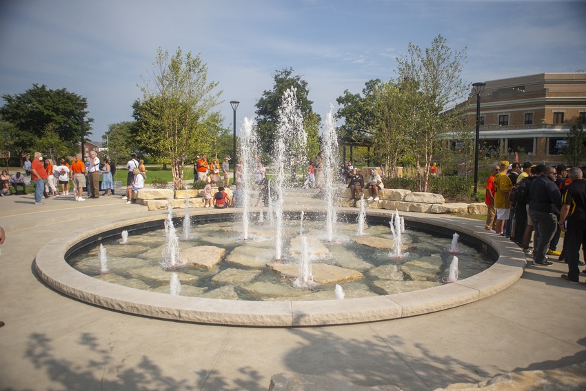 Serving as a centerpiece of the gateway, the Schmeltz Family Fountain features nine programmable LED lights that can be lit to match any occasion.