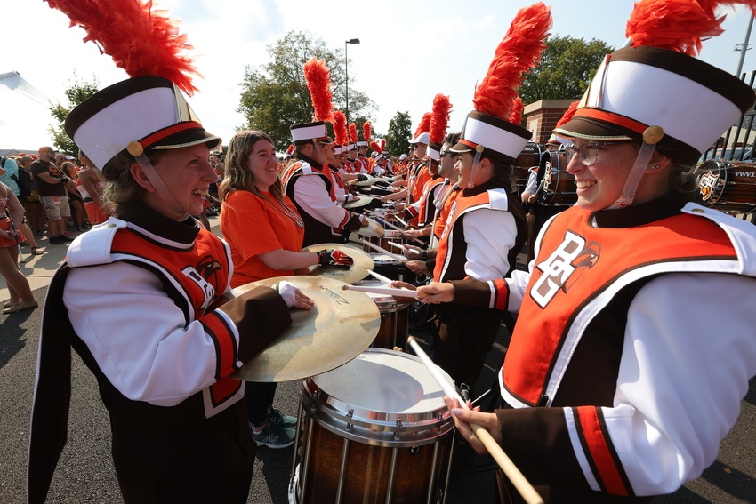 The Falcon Marching Band drumline performs before the game. 