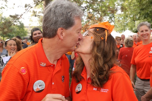 A couple kisses each other