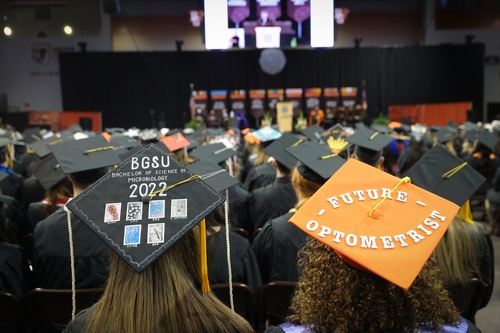 Graduation cap shows microbiology and future optometrist images 