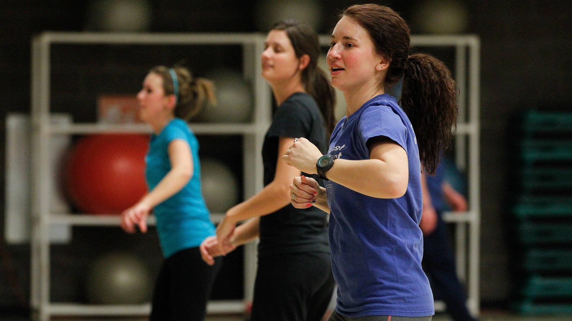People participate in an exercise class.