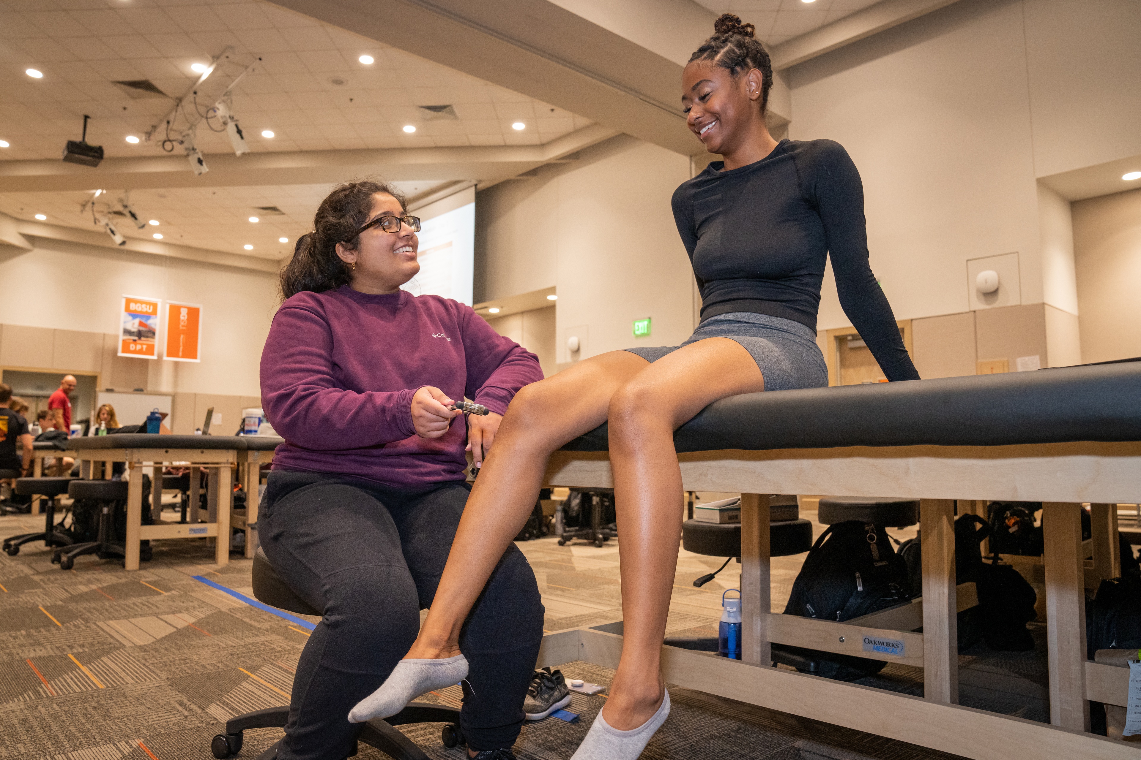 Two BGSU Doctor of Physical Therapy students practice techniques during an in-person session.