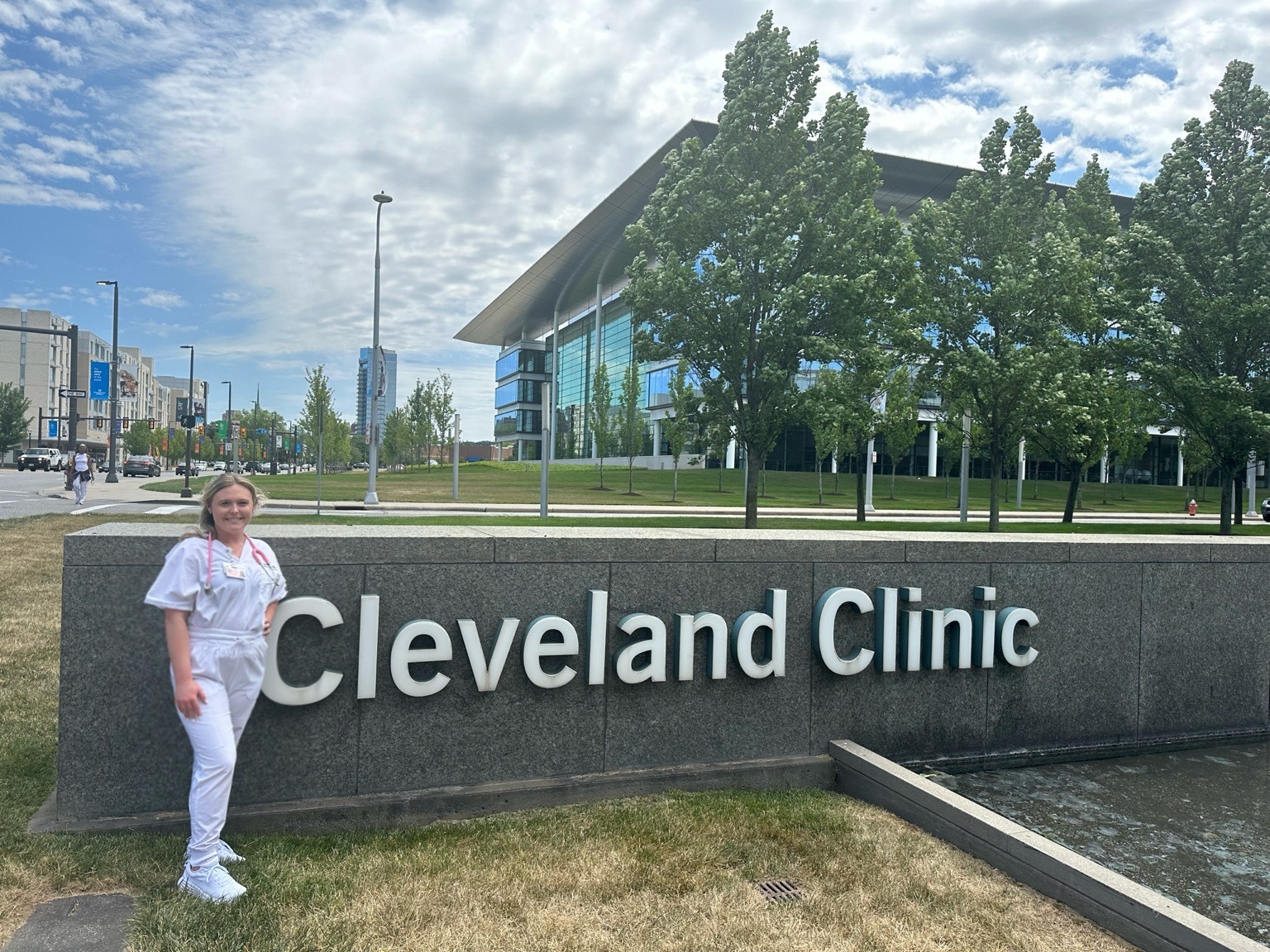 Olivia Riggs in front of Cleveland Clinic