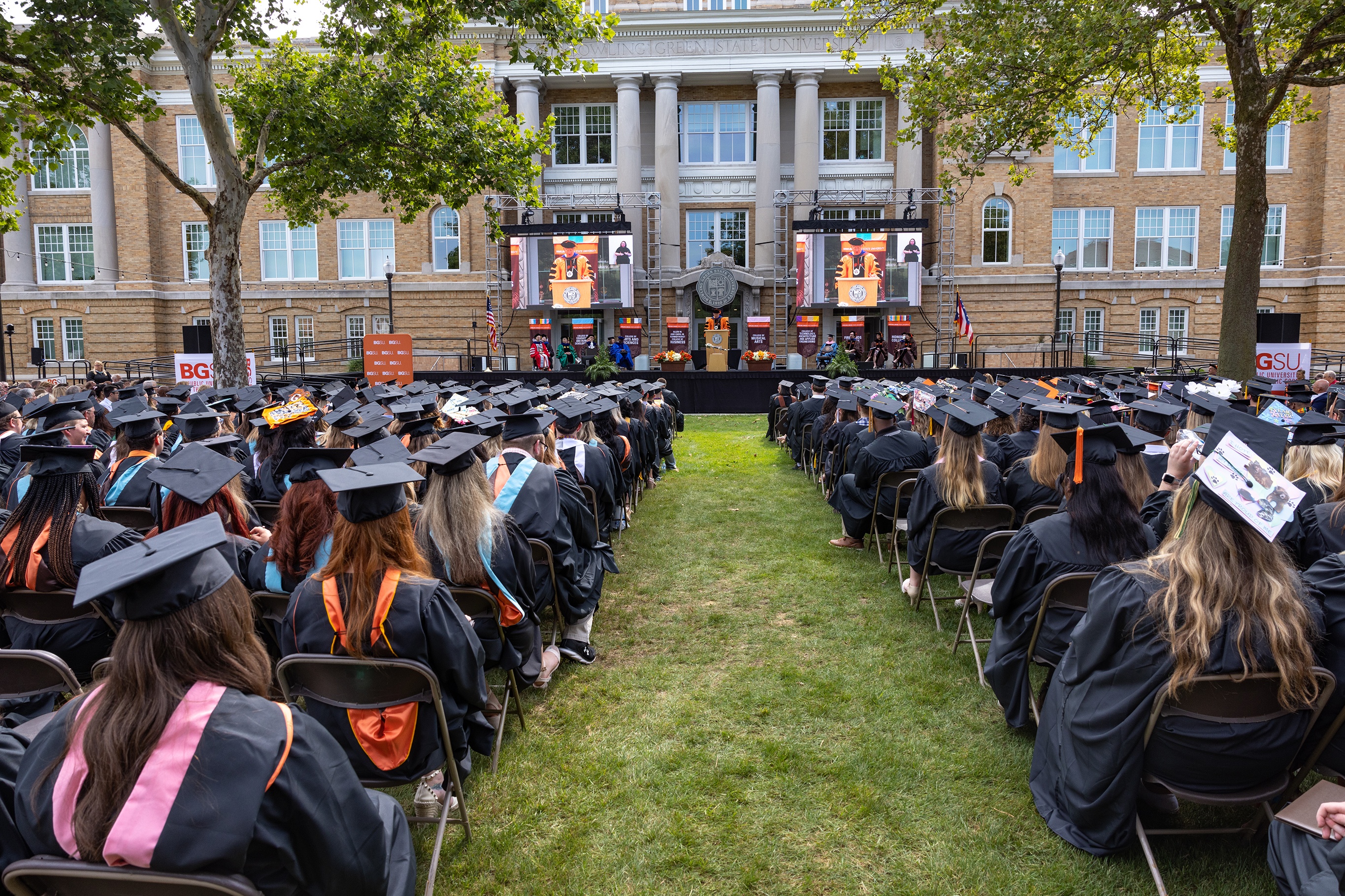 Graduates prepare to cross the Commencement stage.