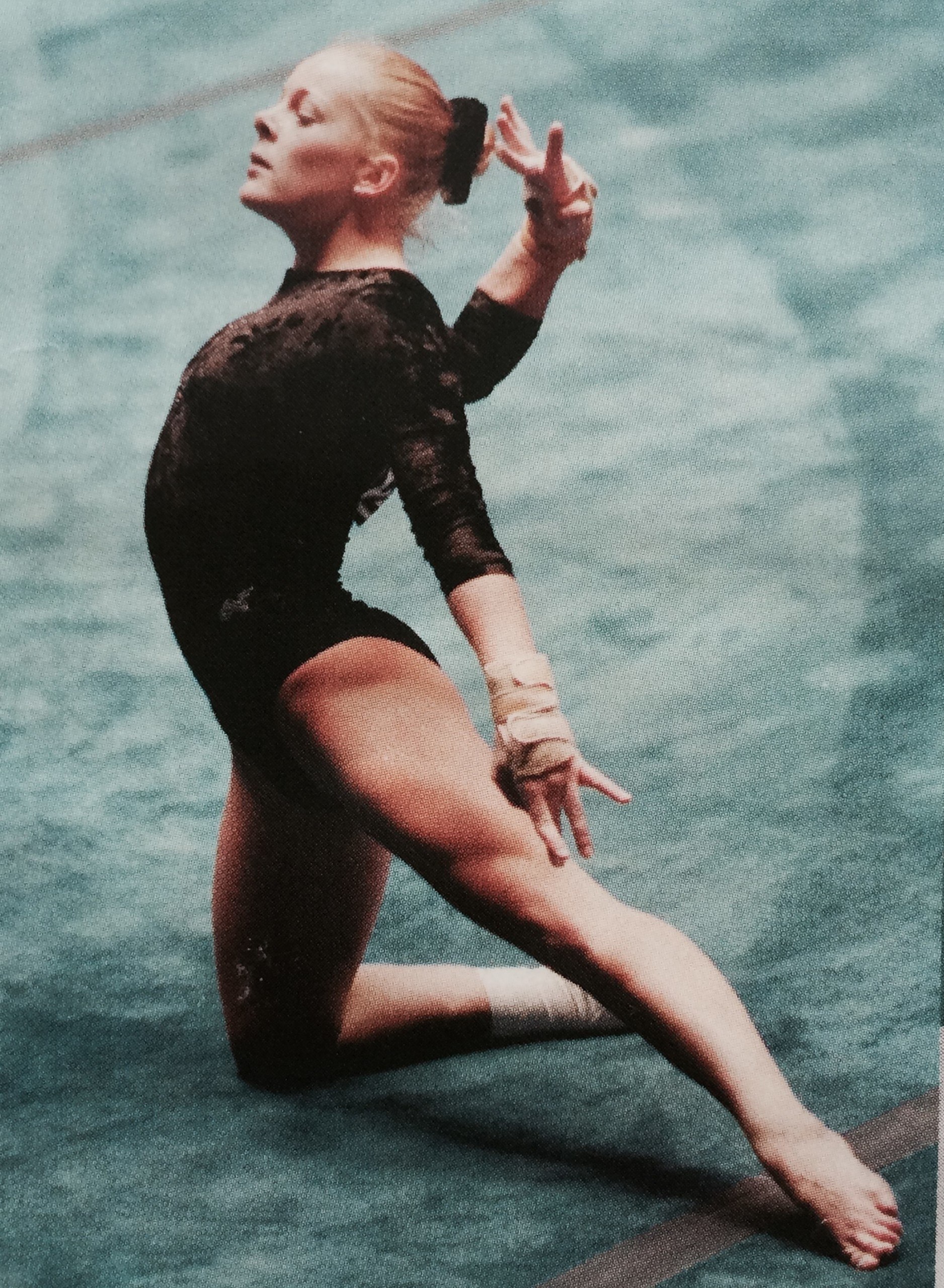A gymnast during a floor exercise routine.