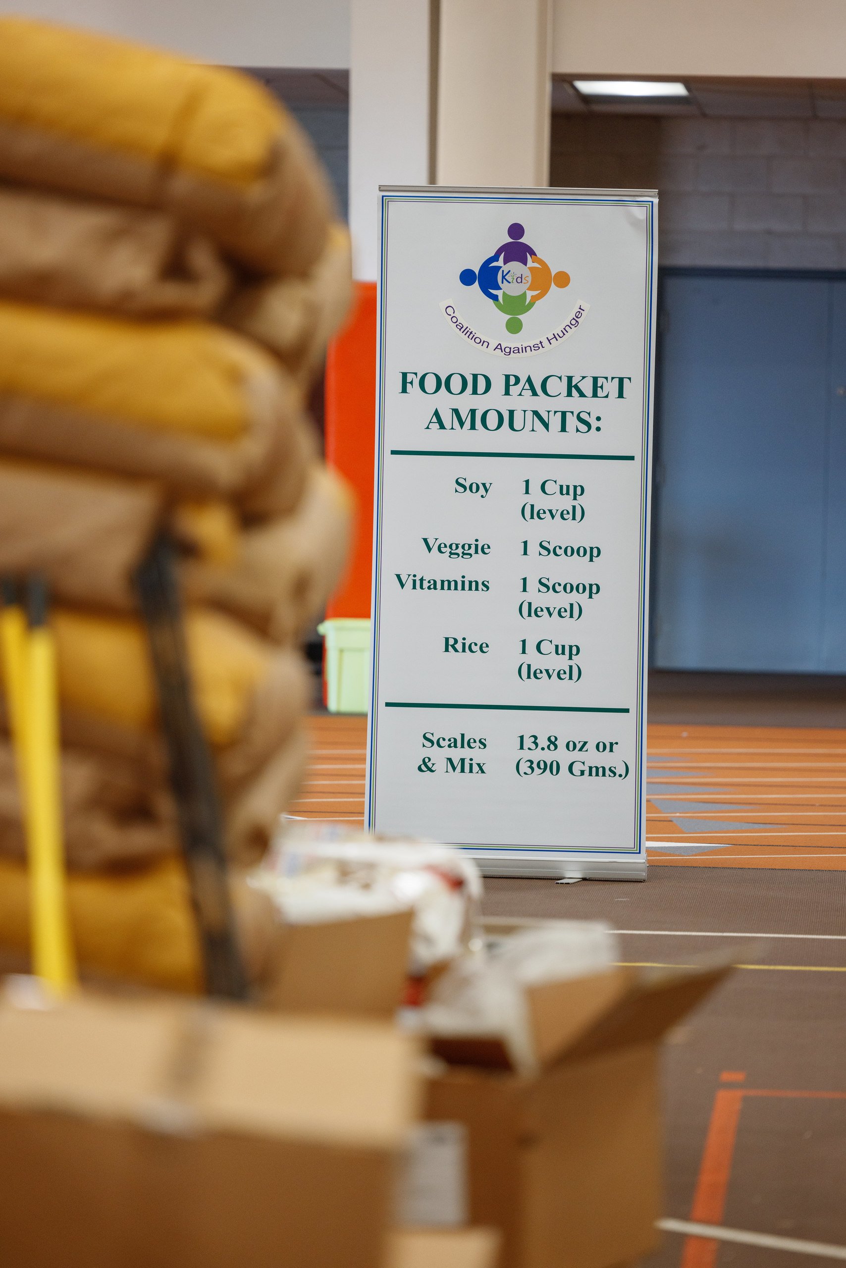 Sign showing measurements for volunteers to create food packets