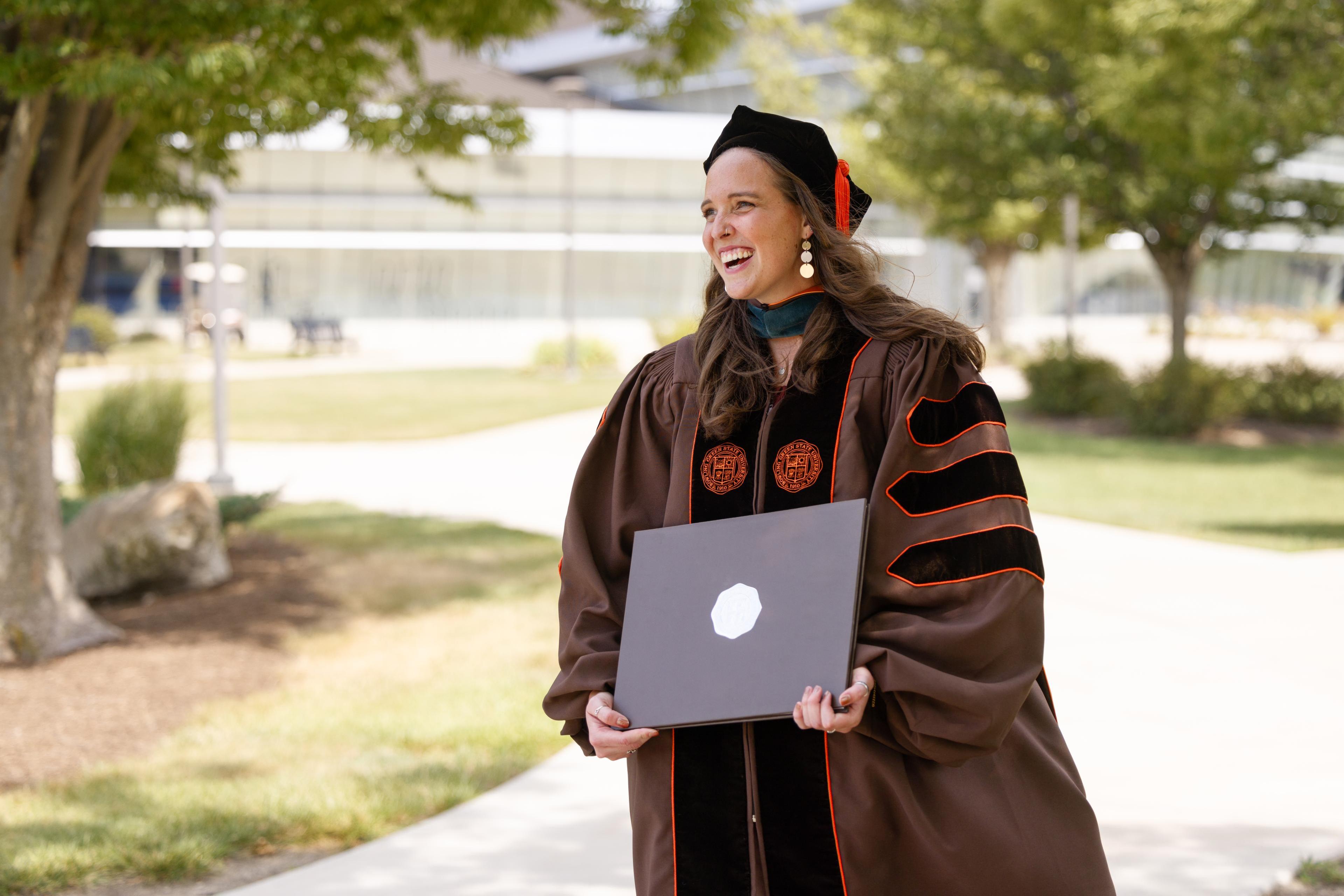 Recent BGSU alumna Dr. Karissa Steinkamp holds her diploma