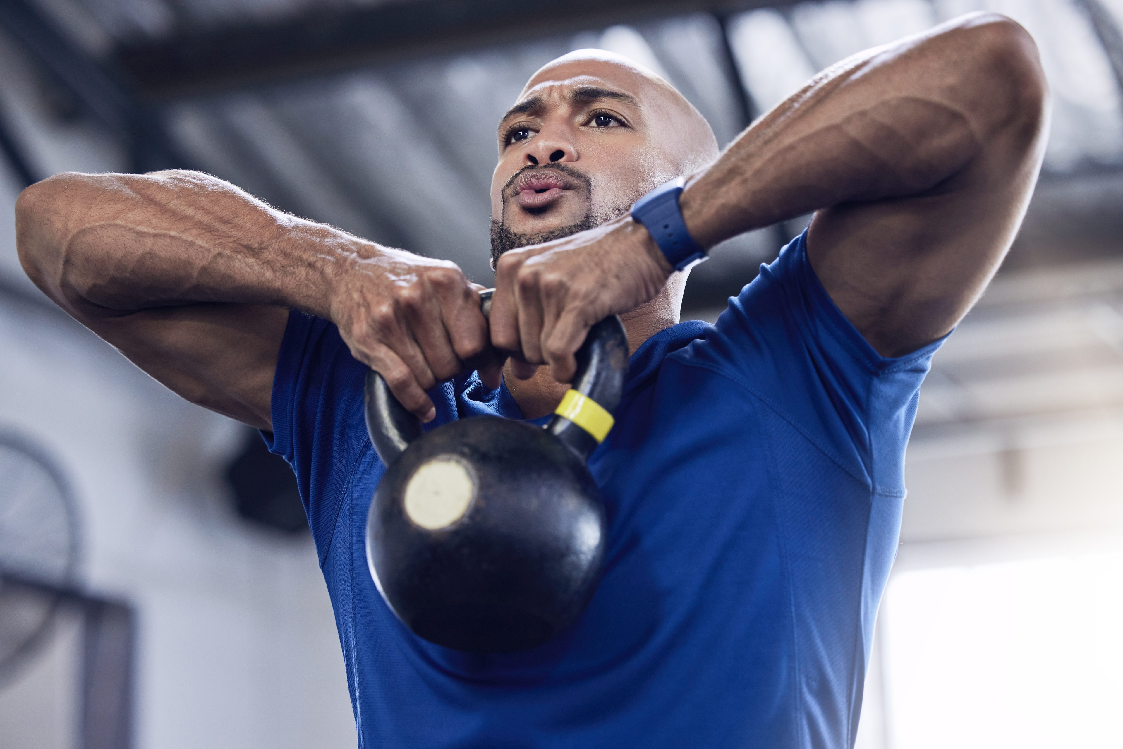 Man lifts dumbbell