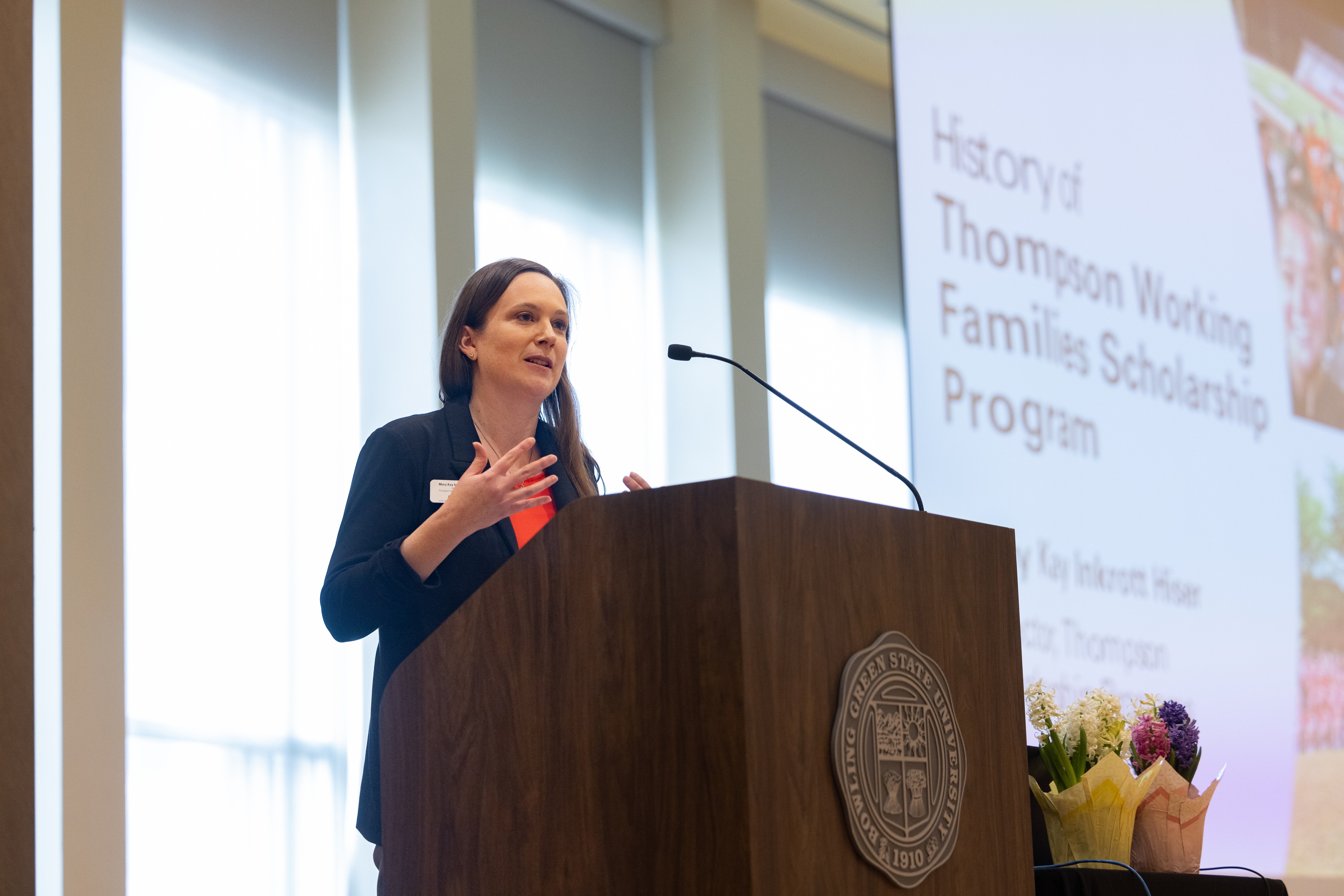 A person speaks at a podium.