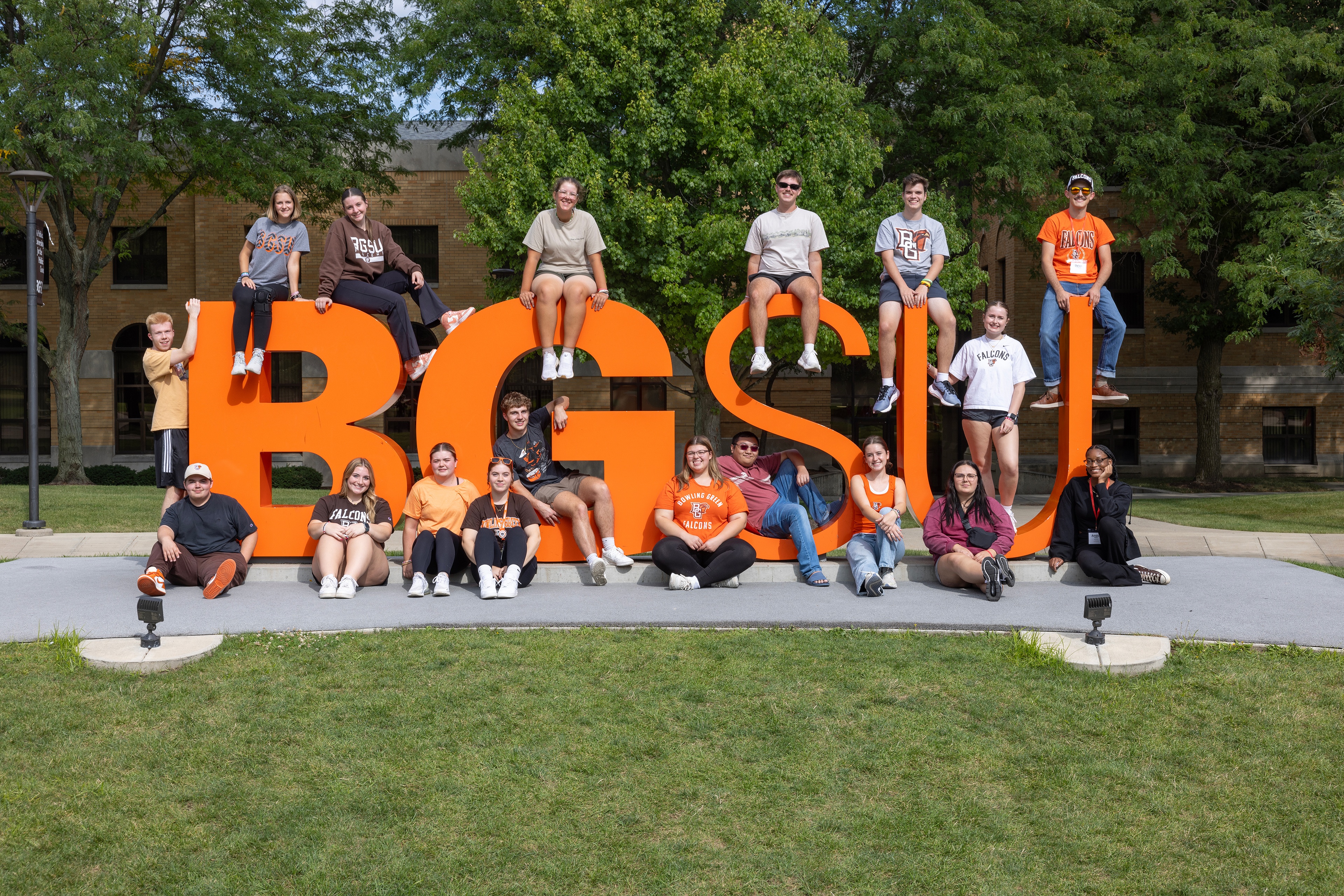 Students pose for a picture on BGSU letters