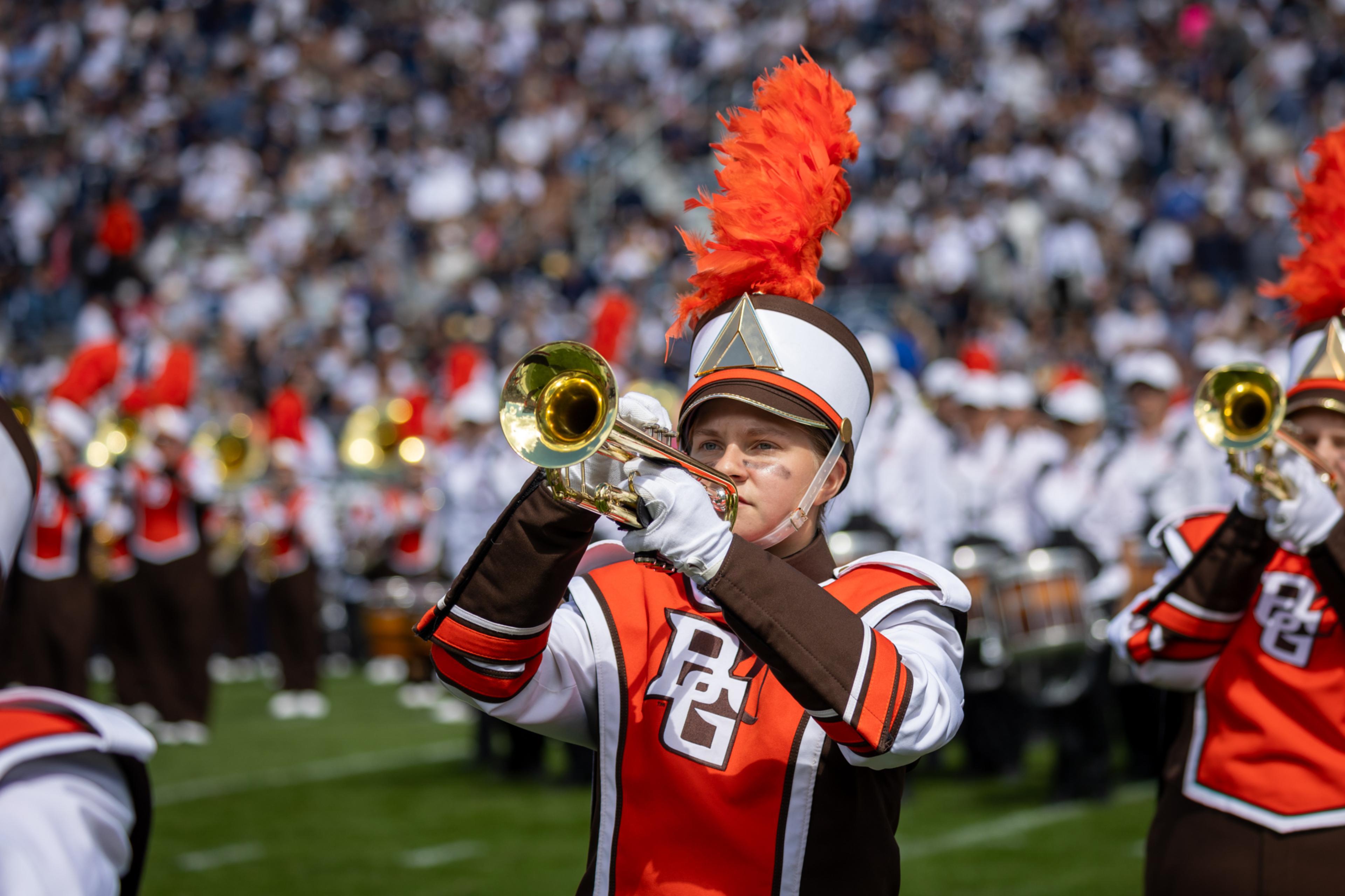 Falcon Band member Maddie Grisier playing a trumpet.