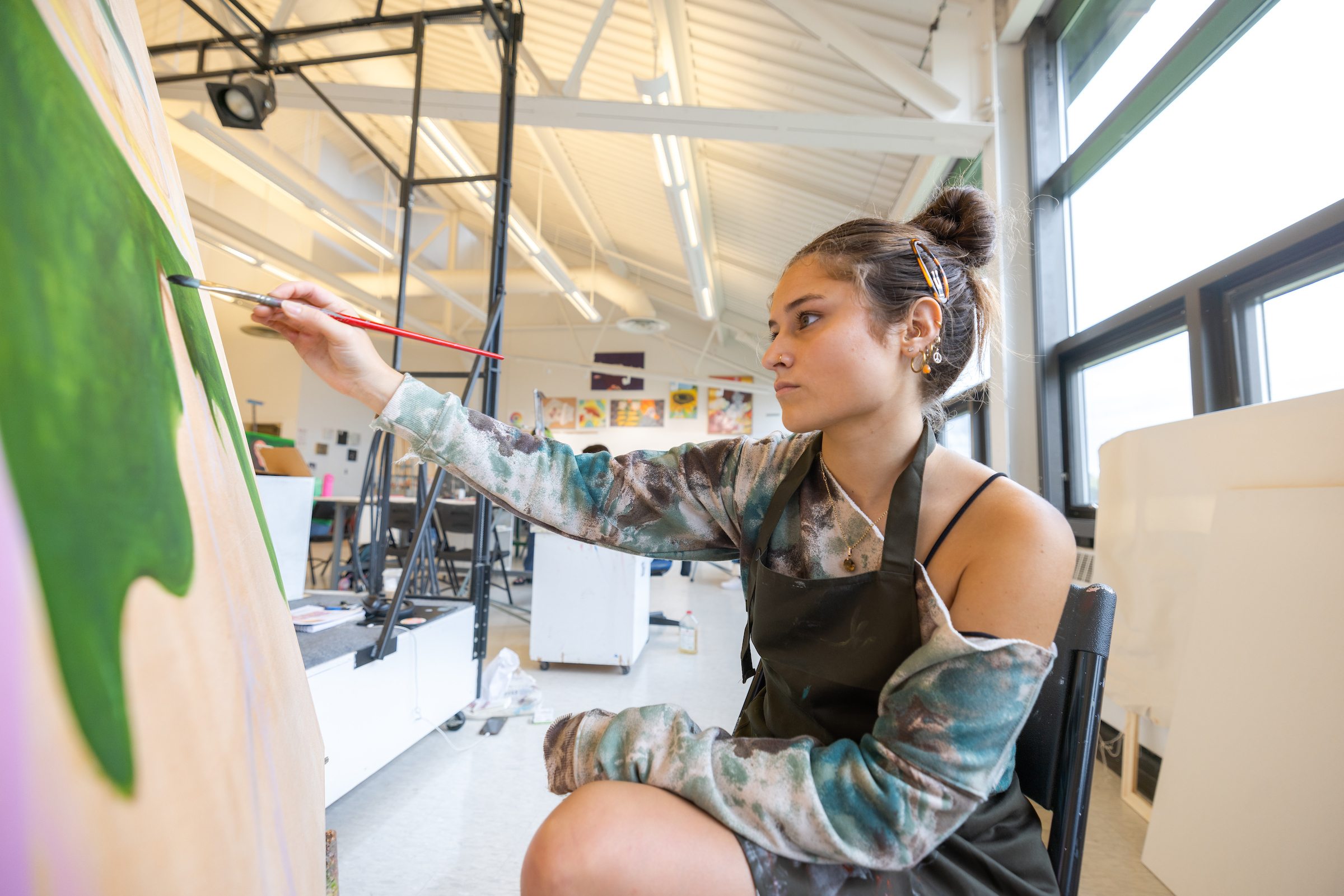 A BGSU student paints during an advanced painting class. 