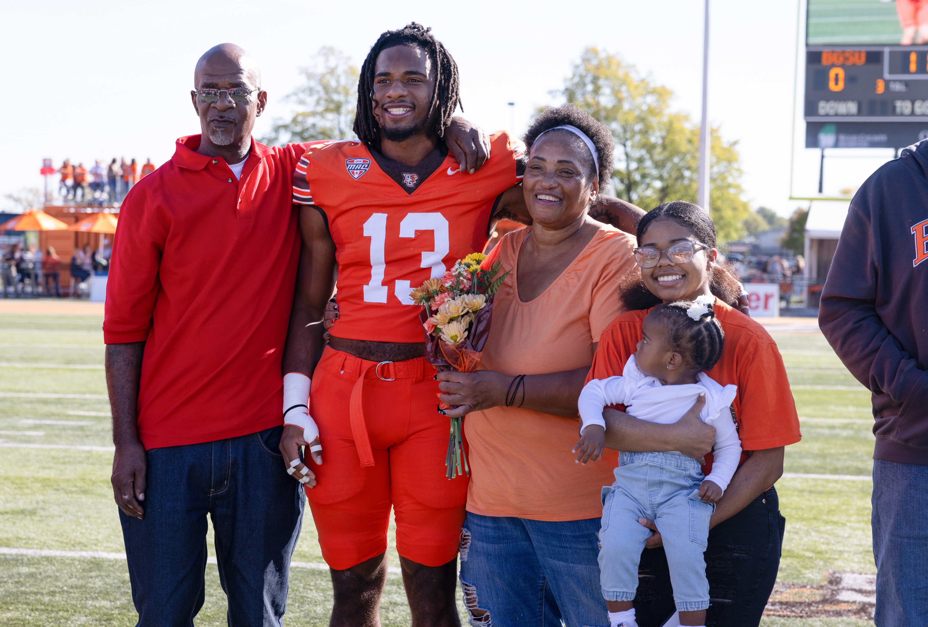 Football player with his family.