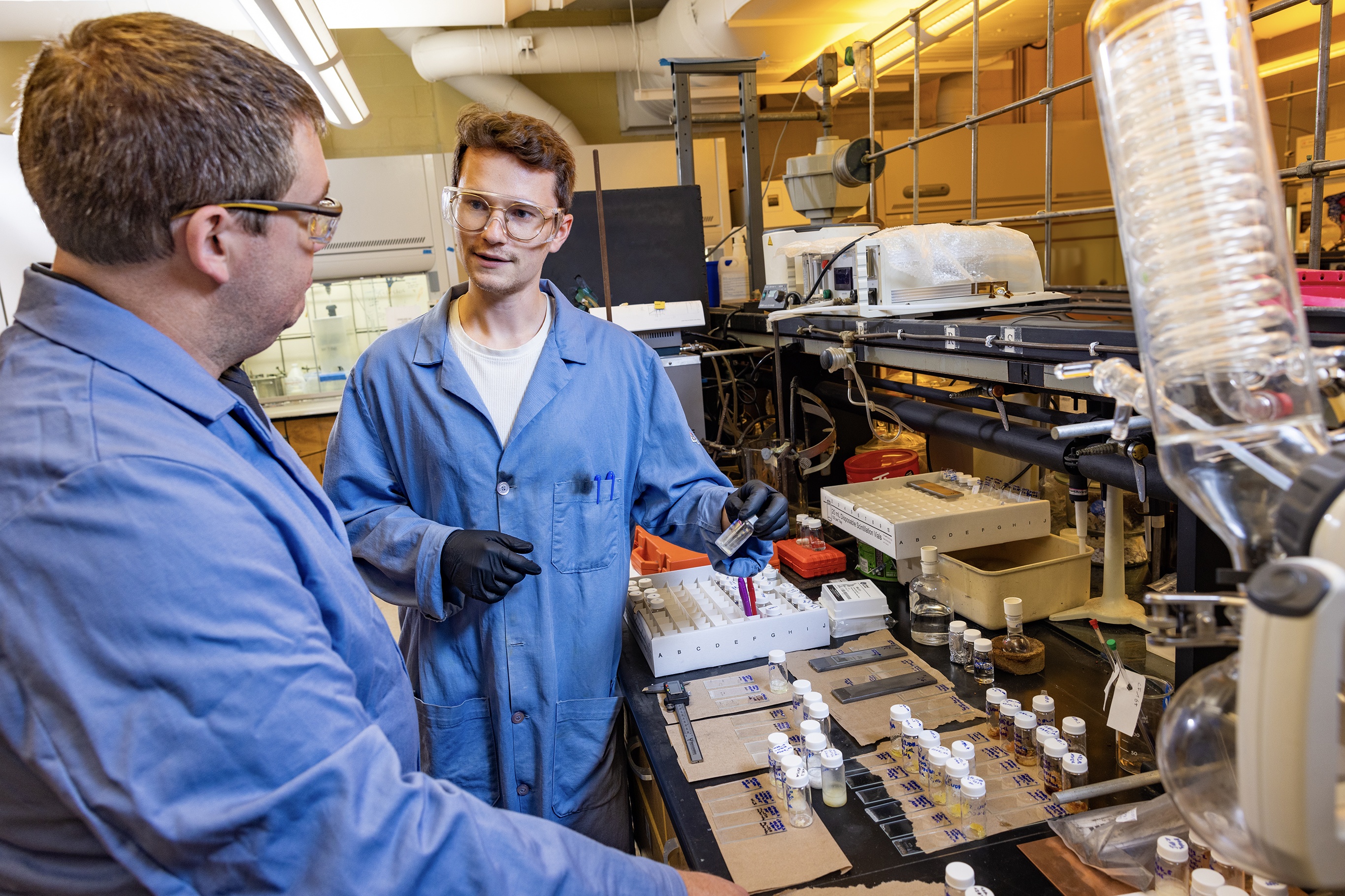 A student and a professor work together in a lab