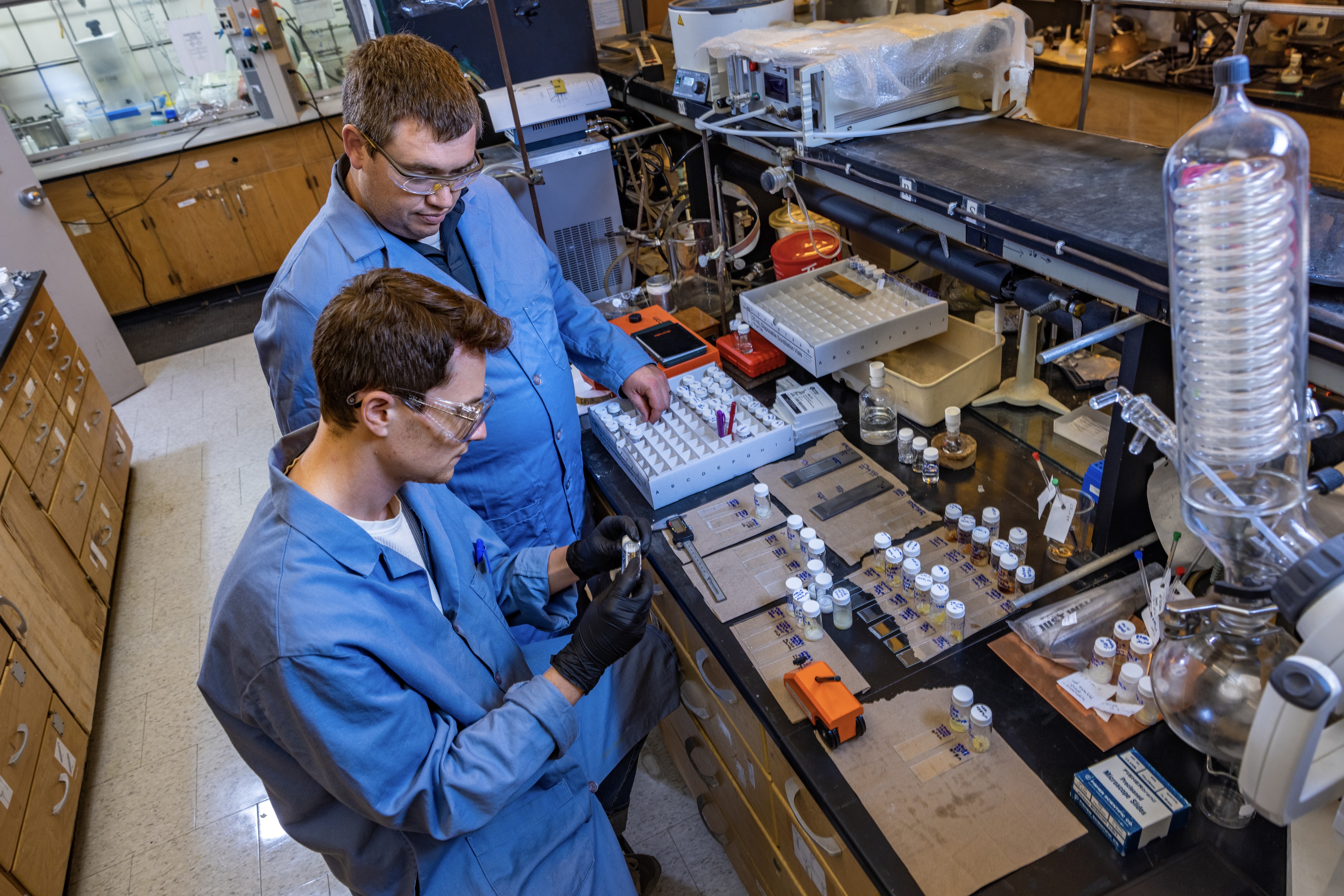 A professor and student work together in a lab