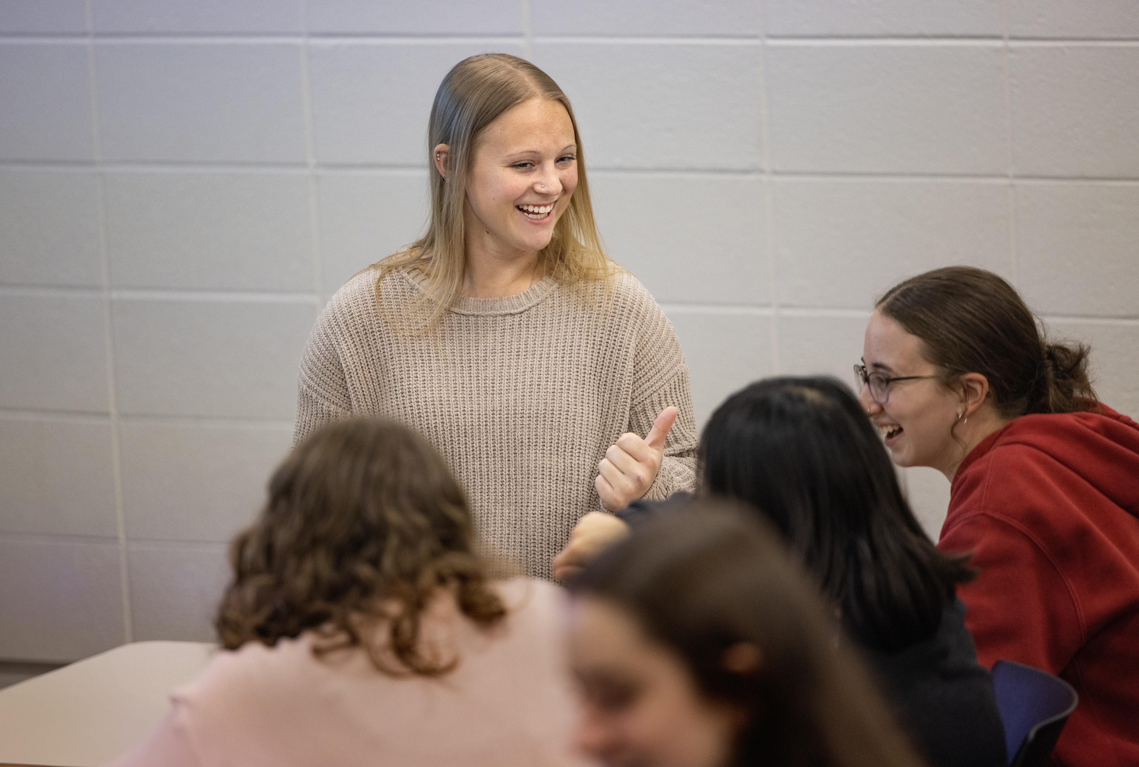 BGSU student Jacklyn Nolan smiles while talking with other students.