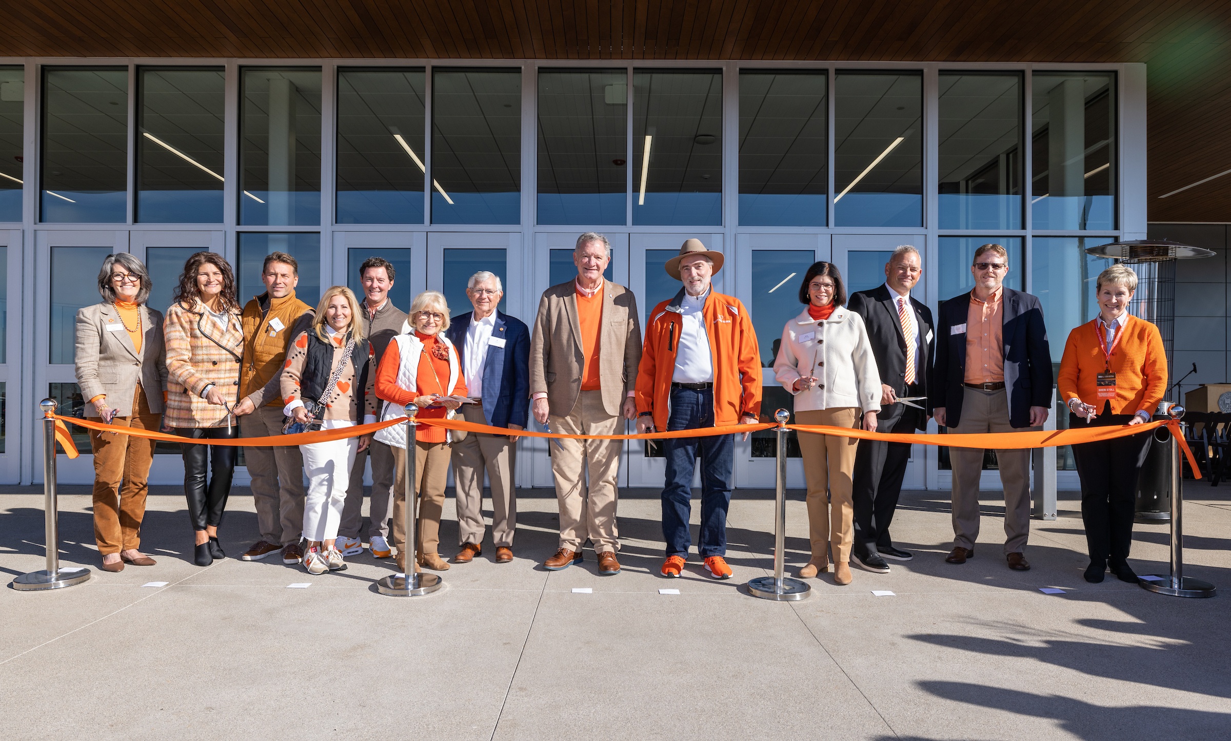 BGSU dignitaries and donors cut a ribbon at Slater Family Ice Arena.