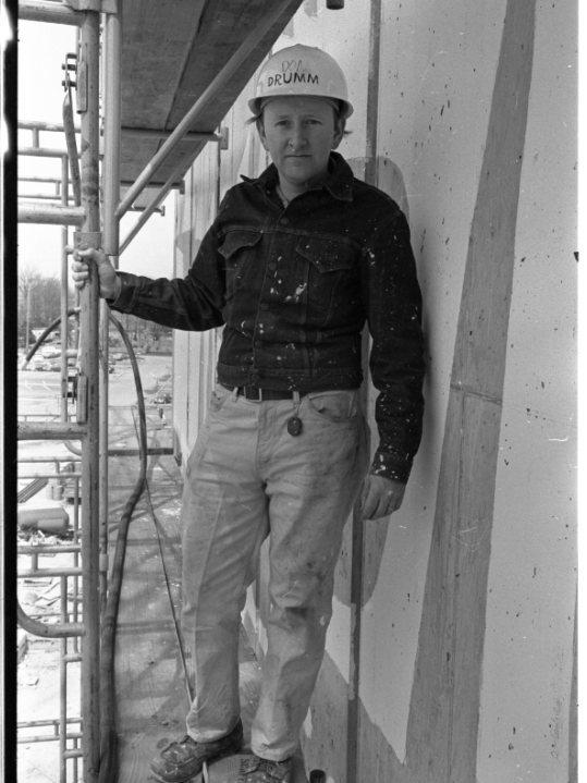 Man in a hardhat poses for a picture