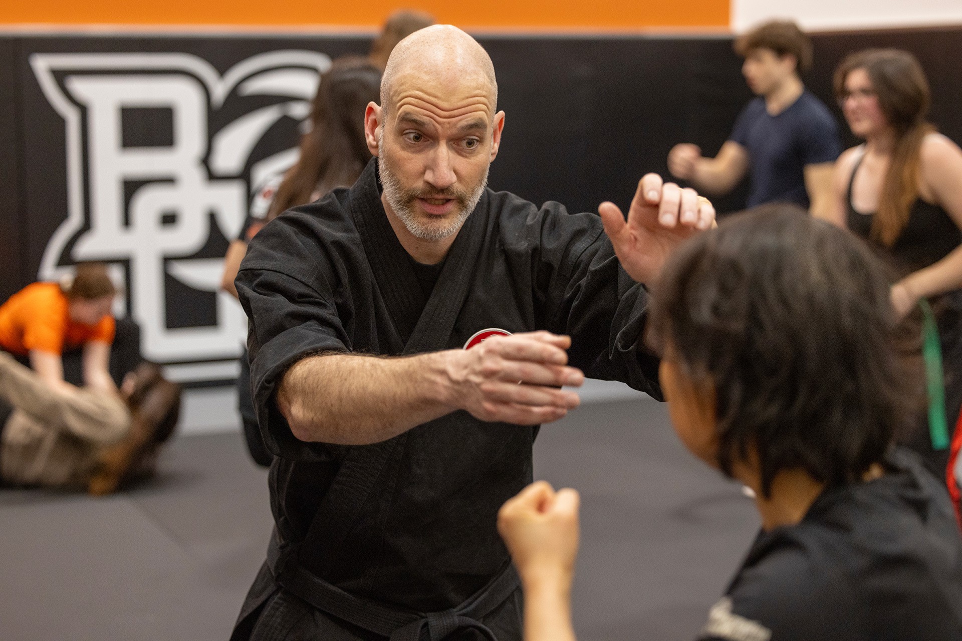 Two people move in a taijutsu class