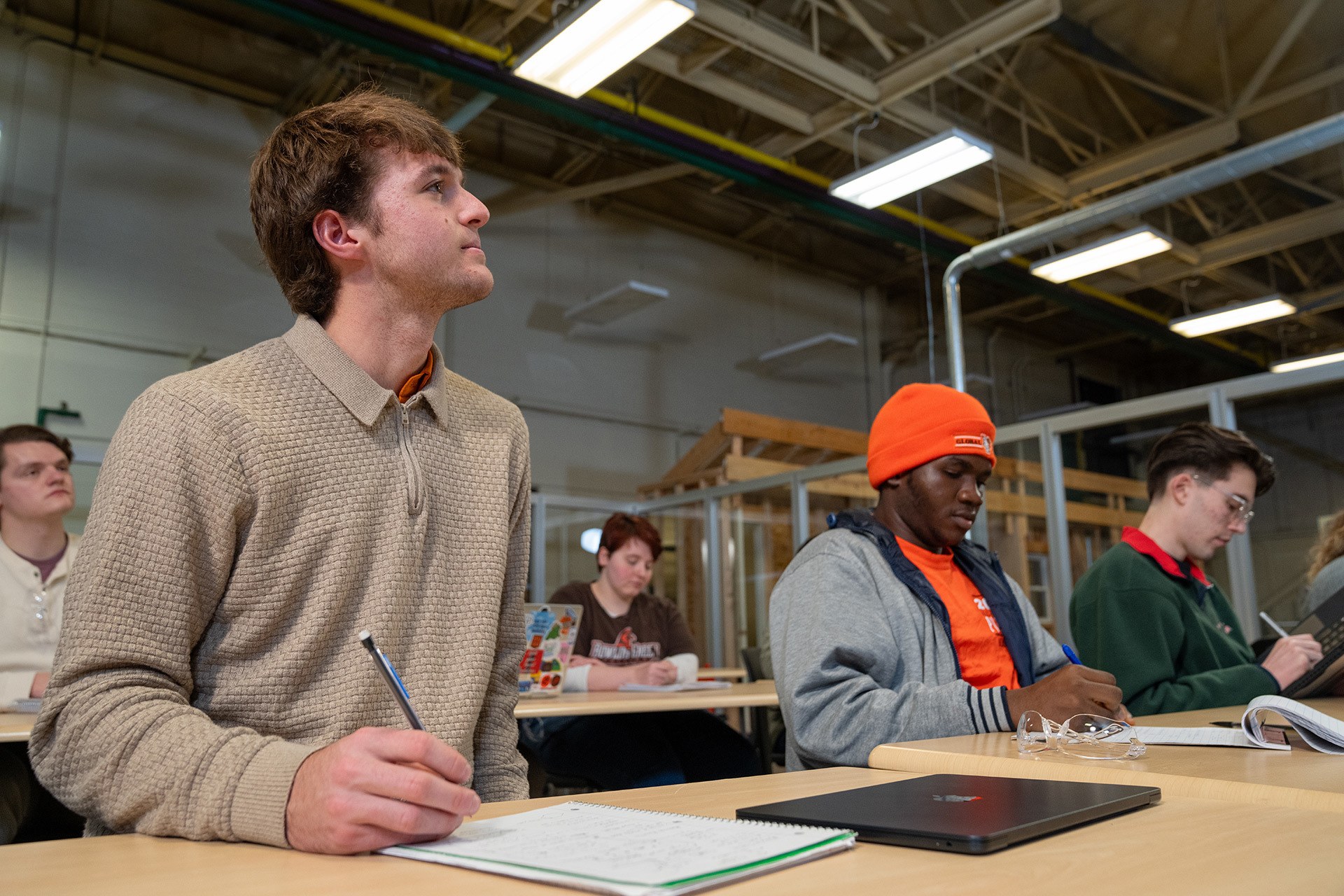 A student takes notes in class.