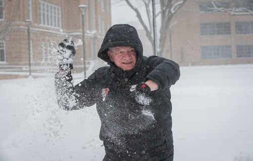 An individual throwing a snowball