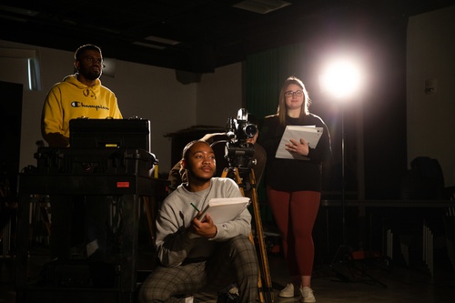 Three students in film class