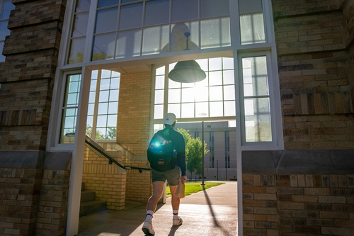 A student walking outside