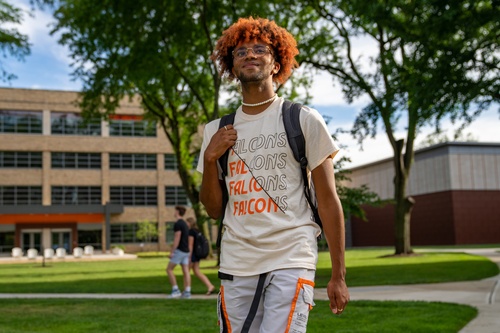 A student walking outside