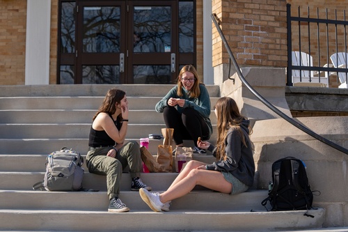 Three students socializing