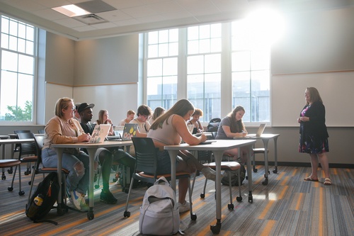 A teacher and students in a classroom