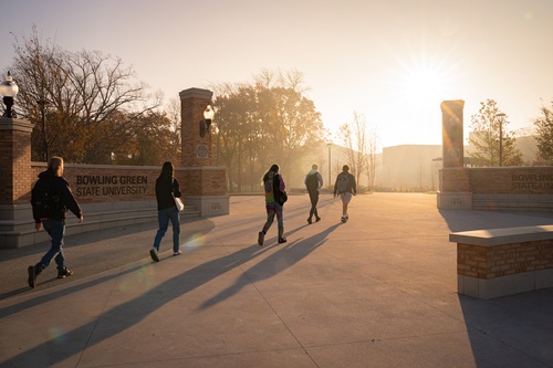 Five students walking