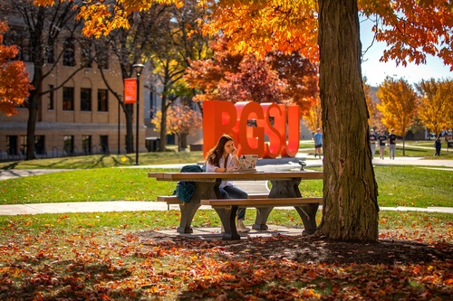 A student doing homework outside