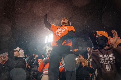 Students cheering at footall game